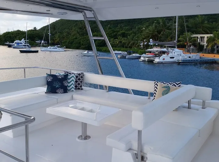 Dash Away Yacht Photos Pics Luxurious Leopard 51 Powercat 2015 yacht with spacious seating, docked in a scenic marina.