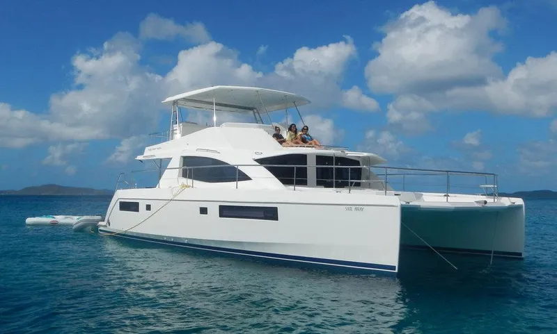 Dash Away Yacht Photos Pics 2015 Leopard 51 Powercat yacht on clear blue water under a partly cloudy sky.