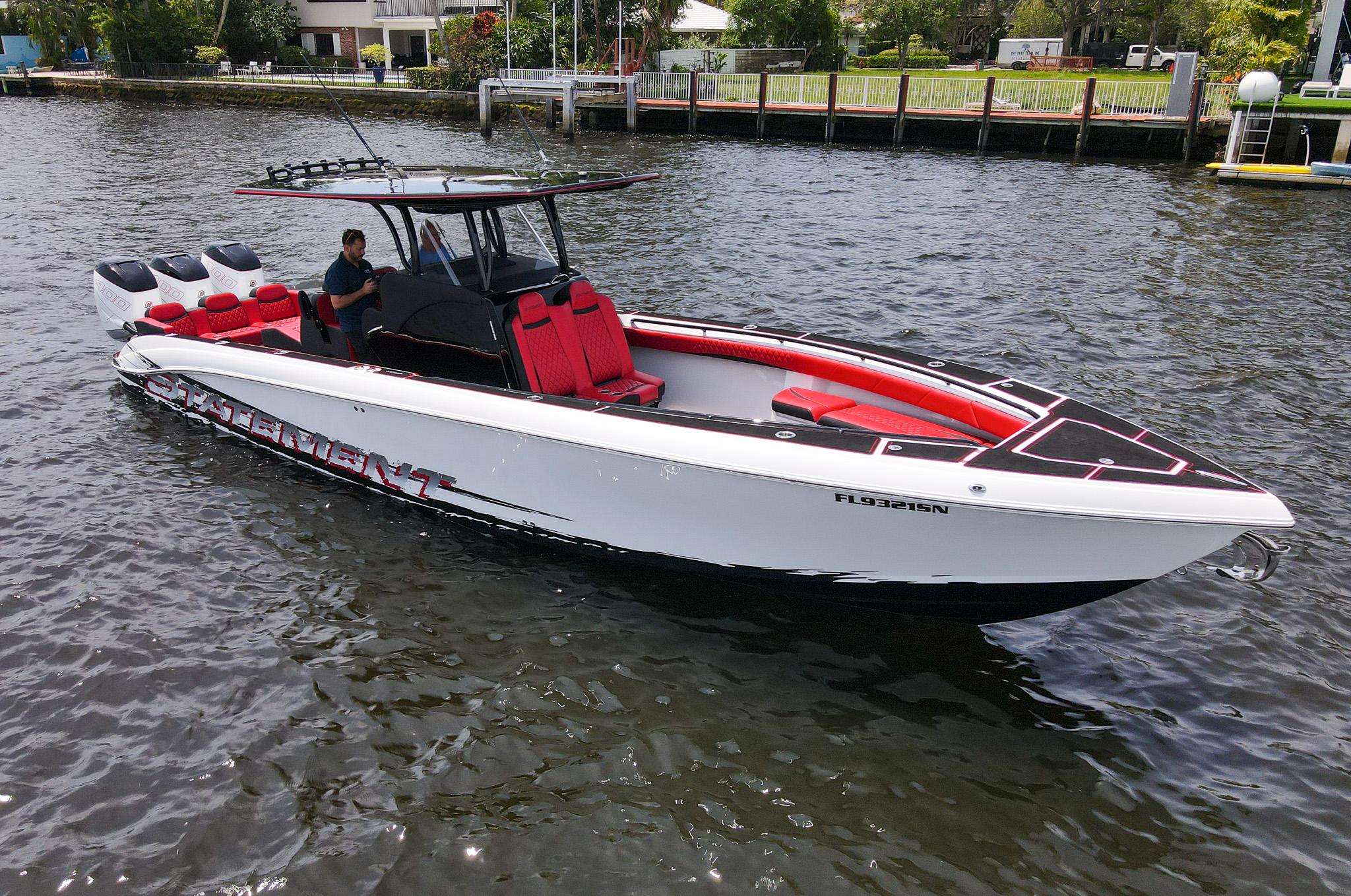 2020 Statement 380 Open boat on water, black and white with red accents.