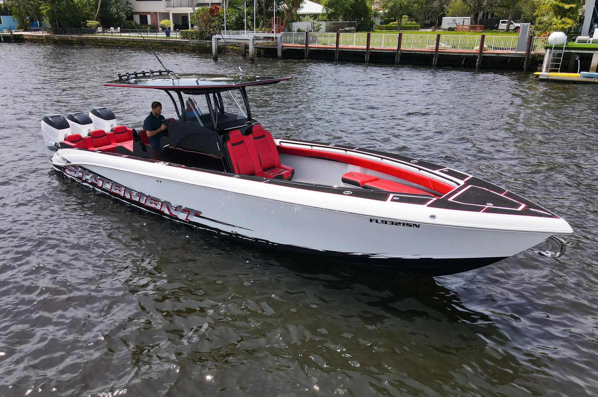 2020 Statement 380 Open boat on water, black and white with red accents.