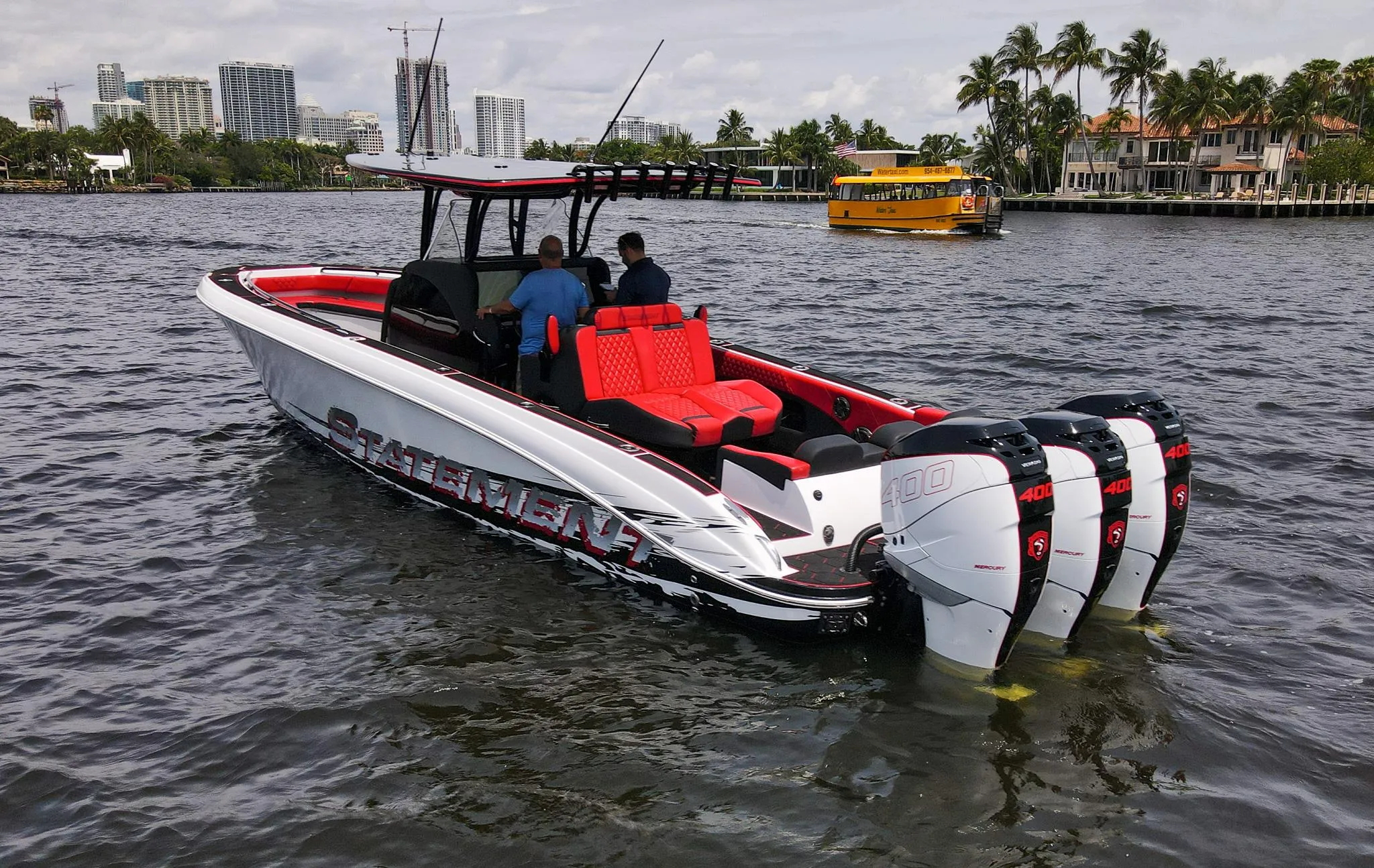 2020 Statement 380 Open boat with four outboard engines on the water.