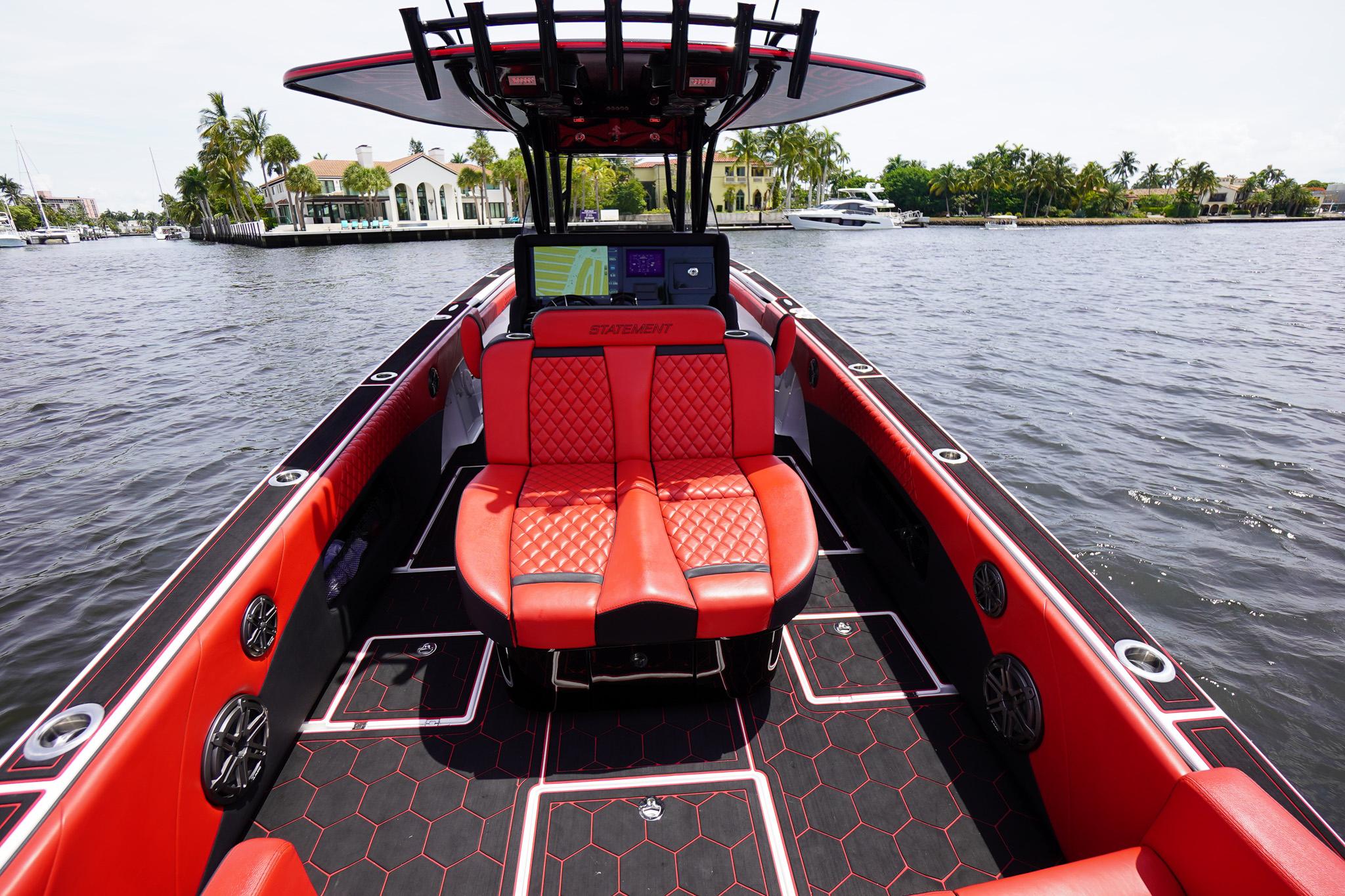 Luxurious 2020 Statement 380 Open boat with red seating on the water.