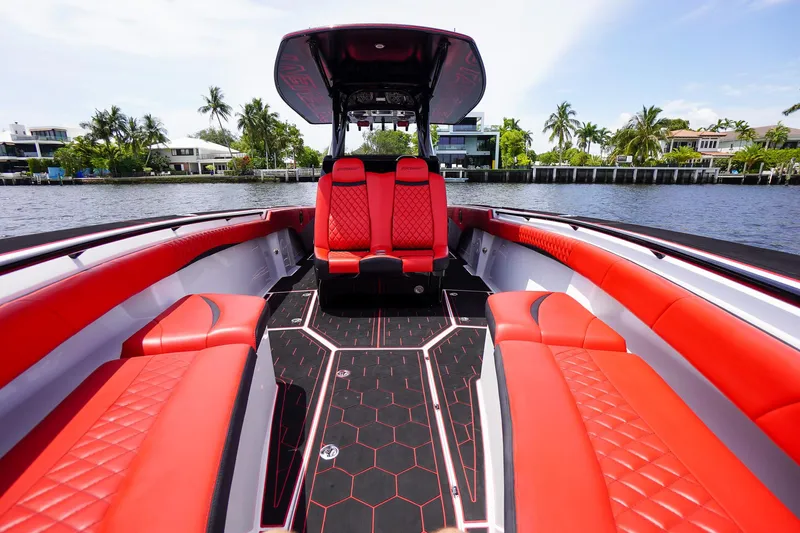  Yacht Photos Pics 2020 Statement 380 Open boat with red seating on water.