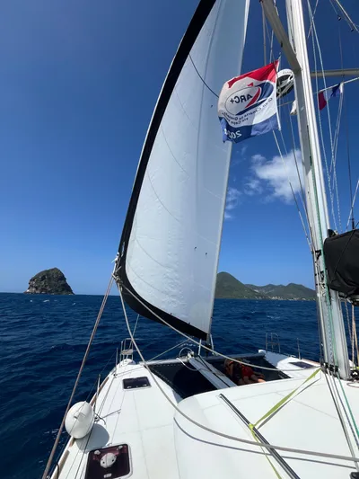 Myrto Yacht Photos Pics Sailing Lagoon 400 catamaran, 2012 model, with scenic ocean and island view.