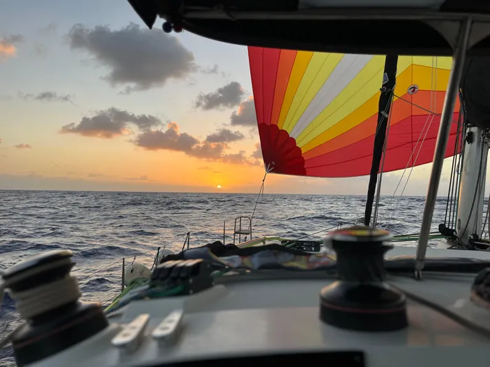 Myrto Yacht Photos Pics Sailing Lagoon 400 at sunset with colorful spinnaker, 2012 model.