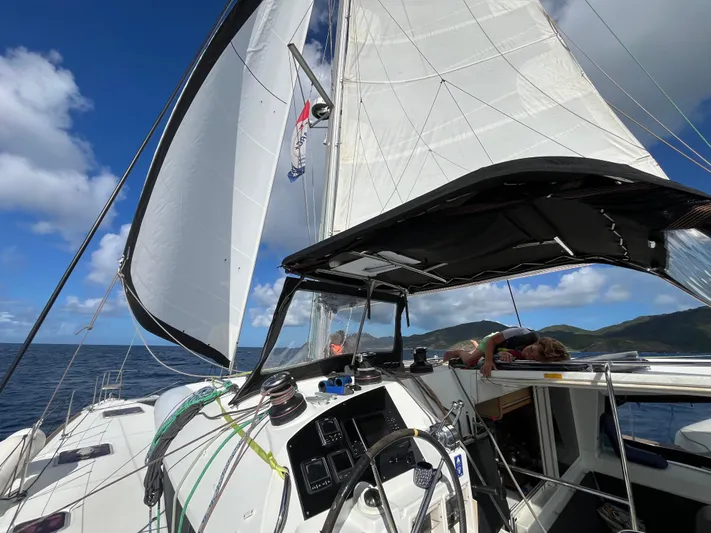 Myrto Yacht Photos Pics Sailing on a 2012 Lagoon 400 catamaran with open sails under a clear blue sky.