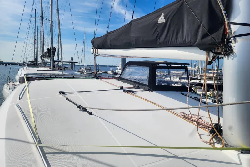 Myrto Yacht Photos Pics 2012 Lagoon 400 catamaran docked at marina under clear blue sky.