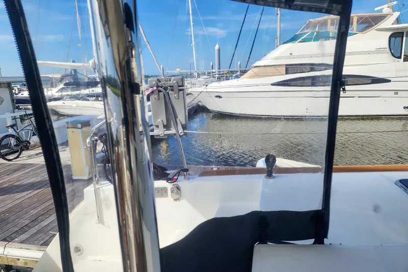 Myrto Yacht Photos Pics View from Lagoon 400 catamaran, docked at marina with other boats, clear blue sky.