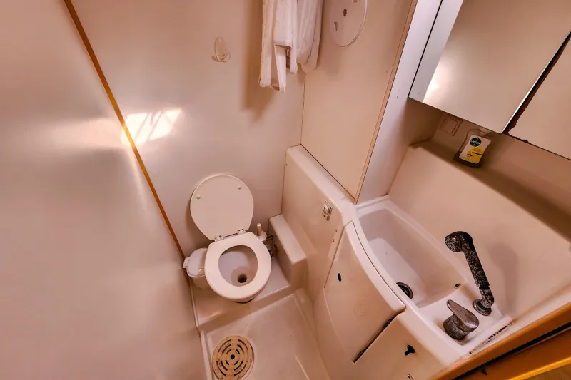 Myrto Yacht Photos Pics Compact bathroom in a 2012 Lagoon 400 yacht, featuring toilet and sink.