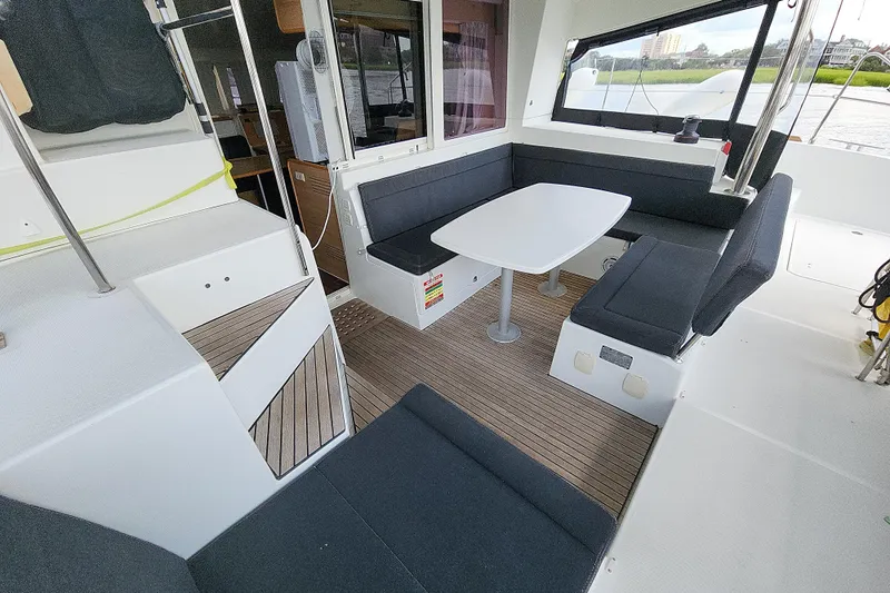 Myrto Yacht Photos Pics Interior of 2012 Lagoon 400 catamaran with seating area and table.