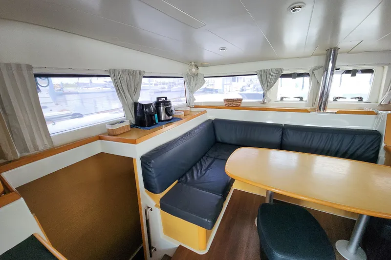 Myrto Yacht Photos Pics Interior of 2012 Lagoon 400 catamaran with cozy seating and dining area.