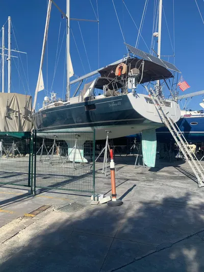  Yacht Photos Pics 2014 Beneteau Oceanis 48 sailboat on dry dock, blue hull, ladder access, sunny day.