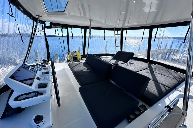 Buena Vida Yacht Photos Pics Luxurious 2023 Lagoon 50 yacht interior with panoramic views and modern navigation controls.