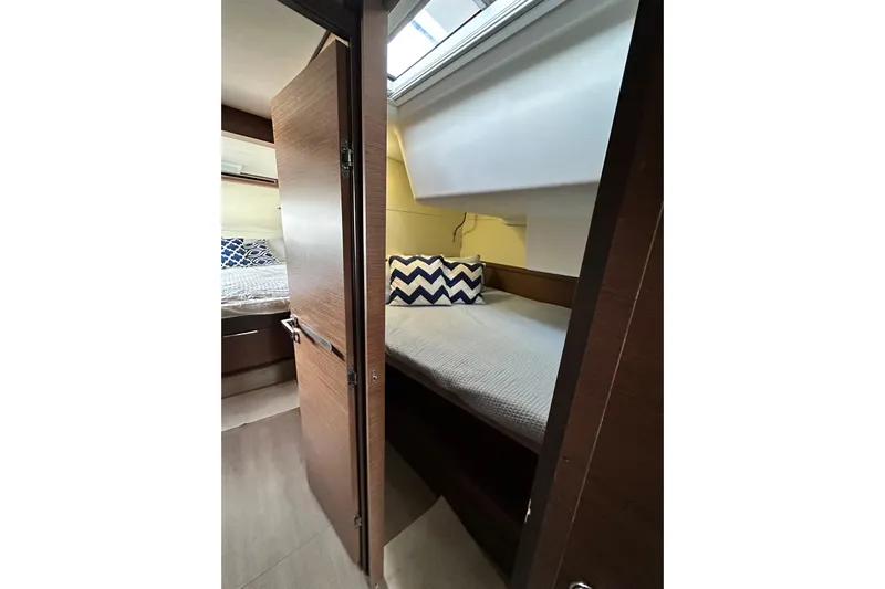 Buena Vida Yacht Photos Pics Interior of 2023 Lagoon 50 yacht, featuring cozy bed and pillow.