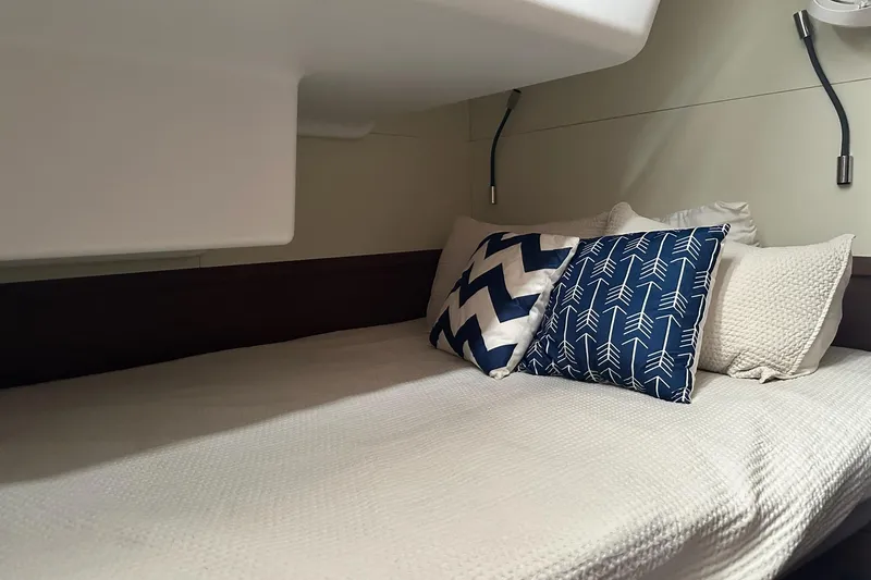 Buena Vida Yacht Photos Pics Cozy cabin bed with decorative pillows in 2023 Lagoon 50 yacht interior.