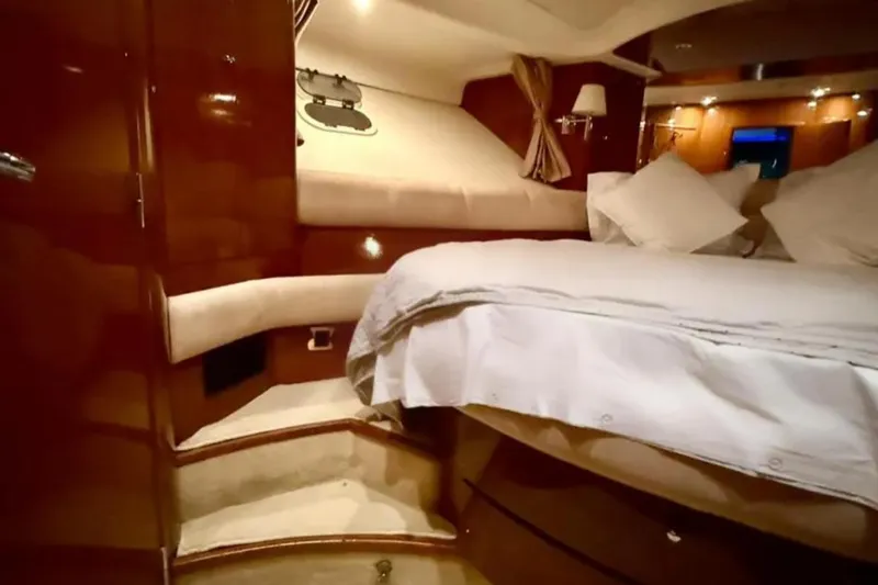  Yacht Photos Pics Luxurious cabin interior of 2005 Jeanneau Prestige 46 yacht with cozy bedding.
