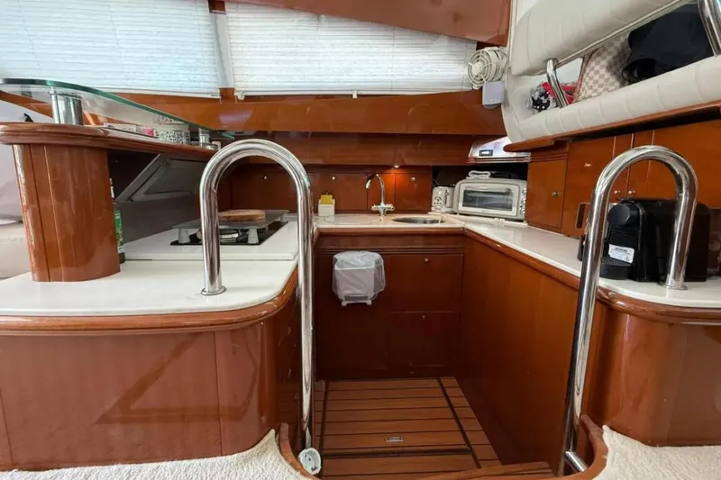 Yacht Photos Pics Luxurious kitchen interior of 2005 Jeanneau Prestige 46 yacht with modern appliances.