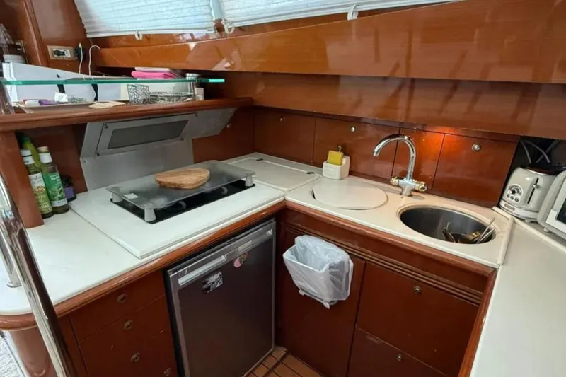  Yacht Photos Pics Luxurious kitchen interior of 2005 Jeanneau Prestige 46 yacht with modern amenities.