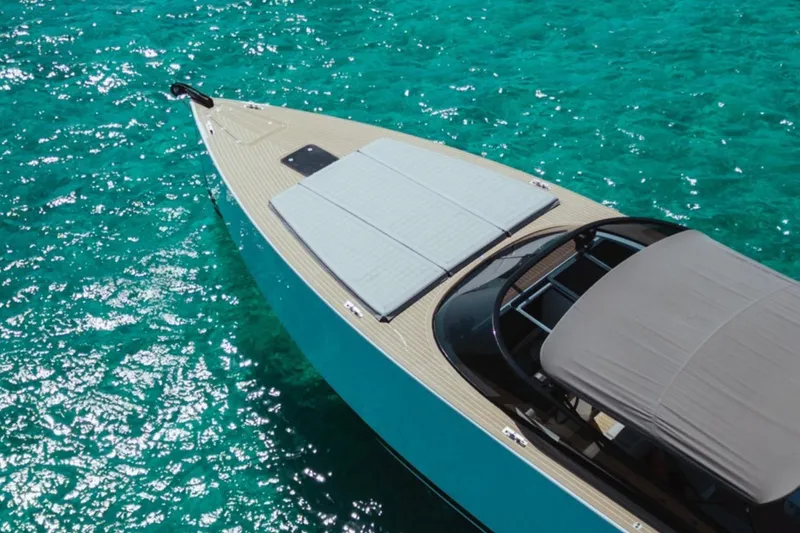 Sin Nombre Yacht Photos Pics VanDutch 55 yacht on turquoise water, showcasing sleek design and luxury features.