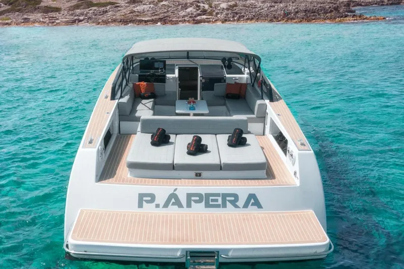 Sin Nombre Yacht Photos Pics Luxurious 2012 VanDutch 55 yacht on clear turquoise water, featuring spacious deck seating.