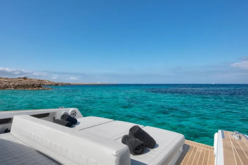 Sin Nombre Yacht Photos Pics Luxurious VanDutch 55 yacht, 2012 model, with sunbathing deck overlooking turquoise sea.