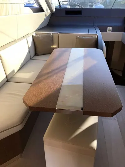  Yacht Photos Pics Luxurious interior of 2014 Dominator 640 S yacht with elegant seating and table.