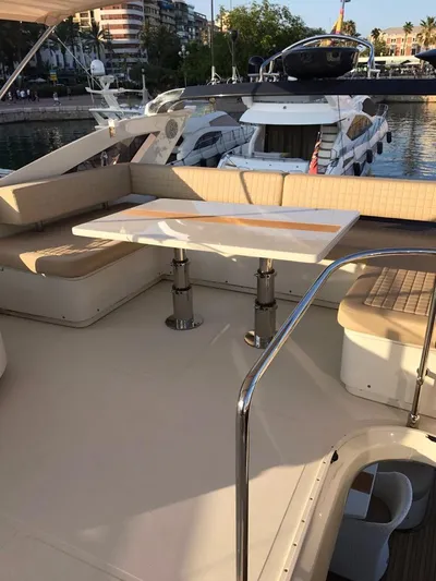  Yacht Photos Pics Luxurious 2014 Dominator 640 S yacht with elegant seating and table on deck.
