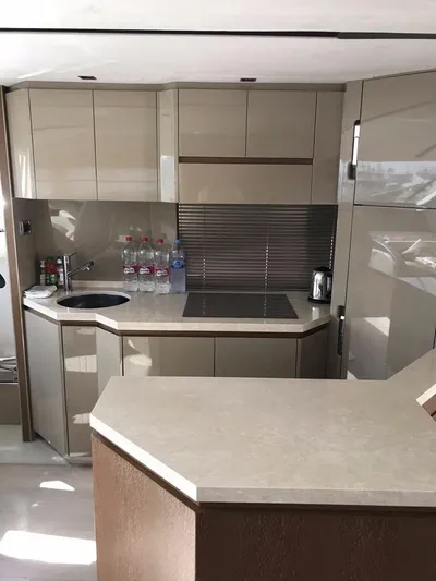  Yacht Photos Pics Modern kitchen interior on 2014 Dominator 640 S yacht with sleek cabinetry and appliances.