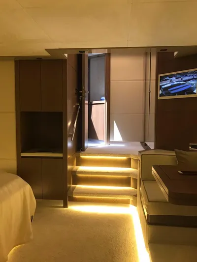  Yacht Photos Pics Luxurious interior of 2014 Dominator 640 S yacht with illuminated stairs and modern decor.