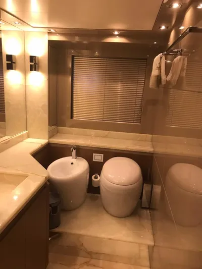  Yacht Photos Pics Luxurious bathroom in 2014 Dominator 640 S yacht with modern fixtures and elegant lighting.