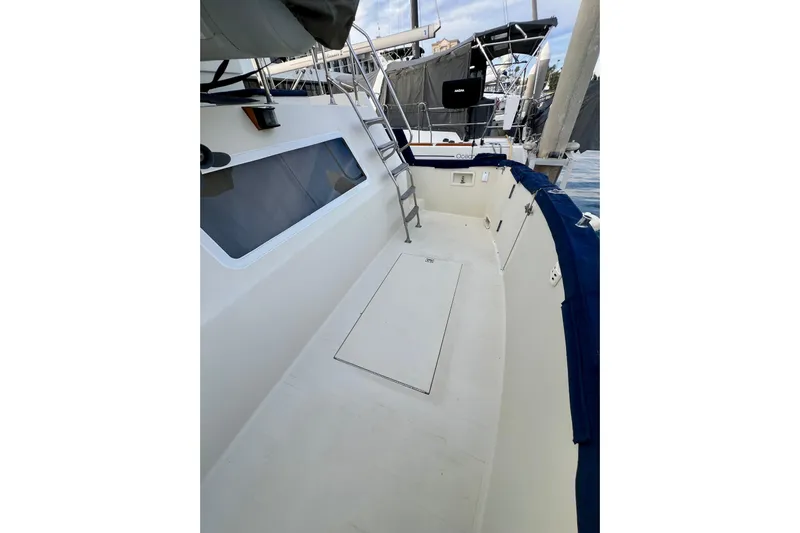 Adios Yacht Photos Pics 1985 Tollycraft 48 Cockpit Motor Yacht deck with ladder and window view.