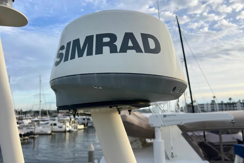 Adios Yacht Photos Pics Simrad radar on 1985 Tollycraft 48 Cockpit Motor Yacht, docked in marina.