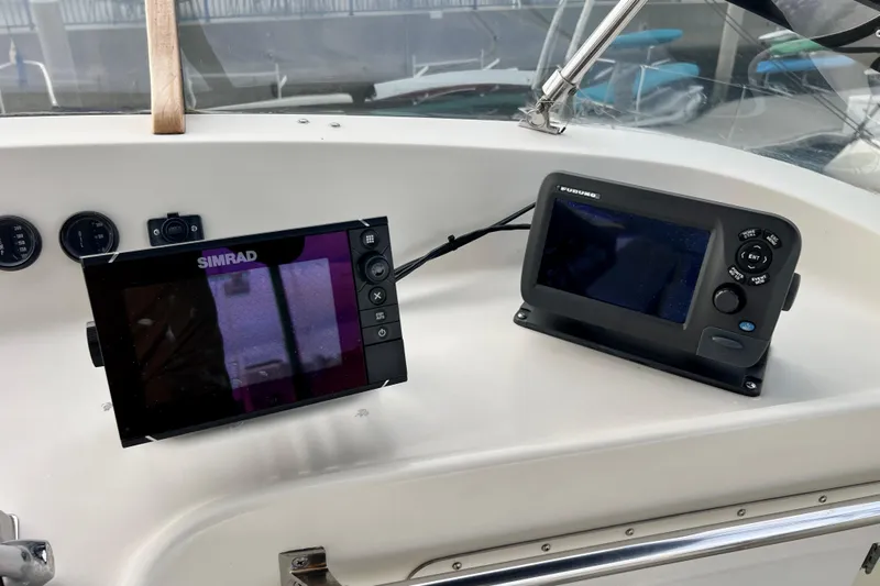 Adios Yacht Photos Pics Navigation equipment on 1985 Tollycraft 48 Cockpit Motor Yacht dashboard.