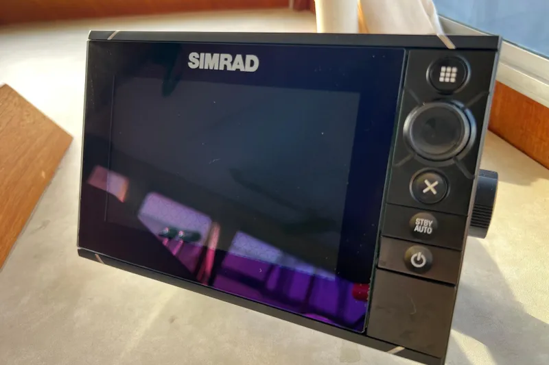 Adios Yacht Photos Pics Simrad marine display on 1985 Tollycraft 48 Cockpit Motor Yacht dashboard.