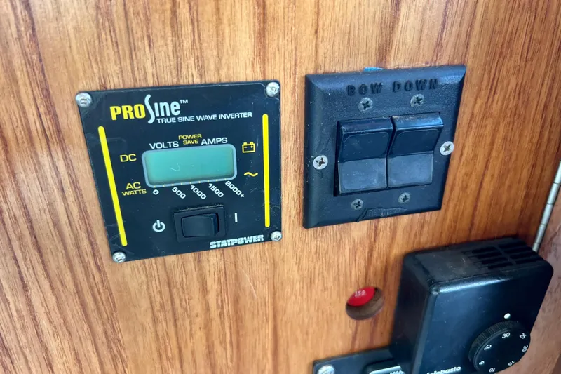 Adios Yacht Photos Pics Control panel on 1985 Tollycraft 48 Cockpit Motor Yacht with ProSine inverter and switches.