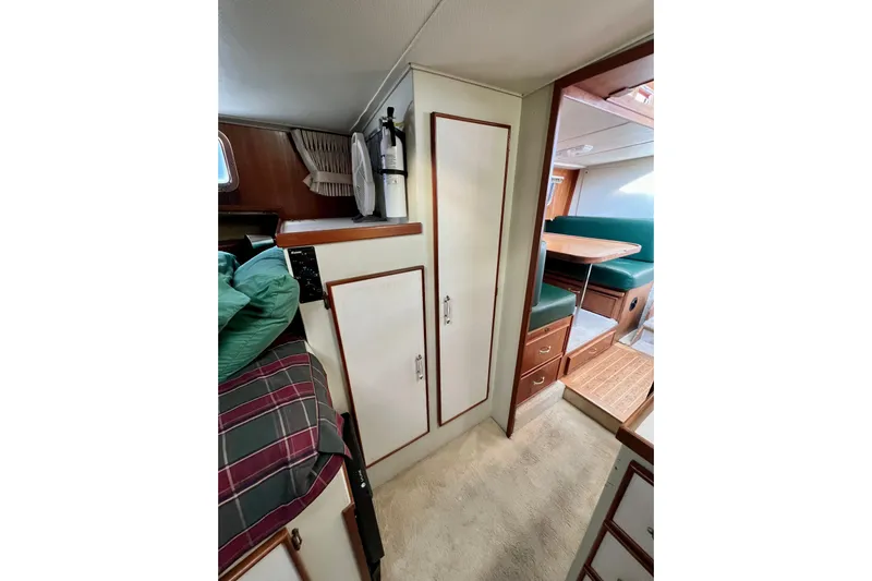 Adios Yacht Photos Pics 1985 Tollycraft 48 Cockpit Motor Yacht interior with cozy cabin and dining area.