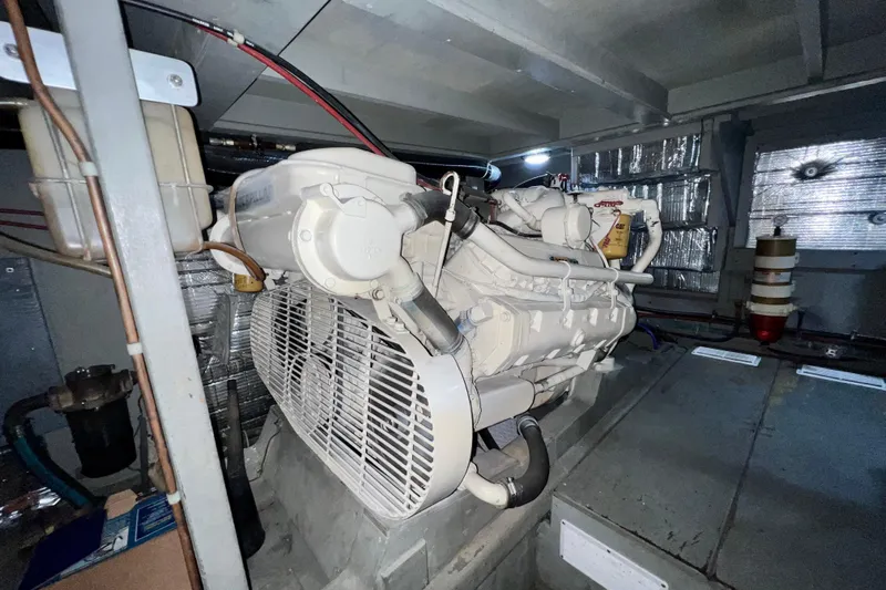 Adios Yacht Photos Pics Engine room of 1985 Tollycraft 48 Cockpit Motor Yacht, featuring a Caterpillar engine.