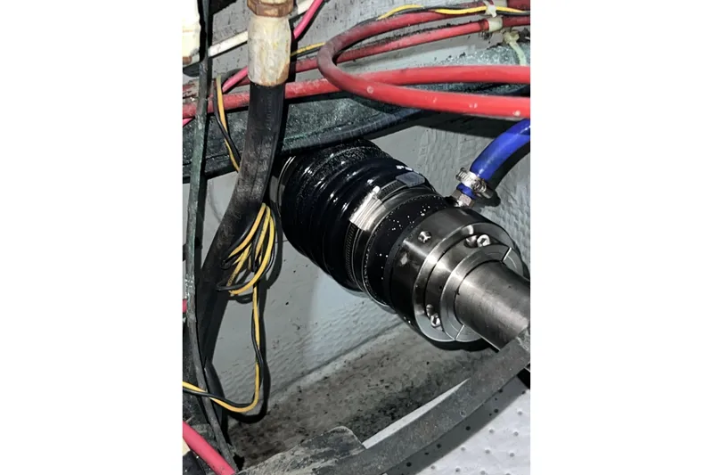 Adios Yacht Photos Pics Engine compartment of 1985 Tollycraft 48 Cockpit Motor Yacht with visible wiring and components.