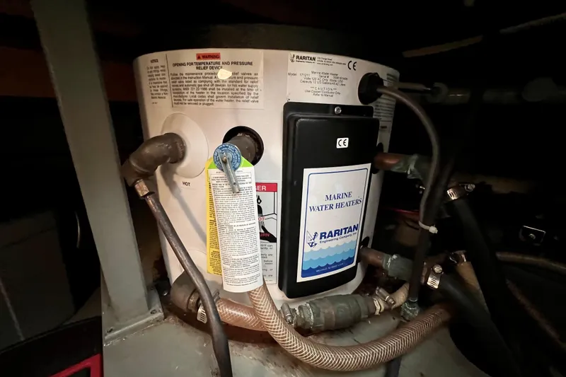 Adios Yacht Photos Pics Marine water heater in 1985 Tollycraft 48 Cockpit Motor Yacht engine room.