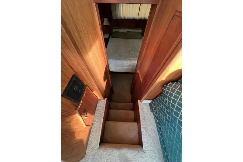 Adios Yacht Photos Pics Stairway leading to cozy bedroom in 1985 Tollycraft 48 Cockpit Motor Yacht.