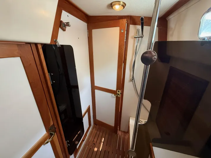 Chance Yacht Photos Pics 1999 Tartan 4100 yacht bathroom with wooden accents and modern fixtures.