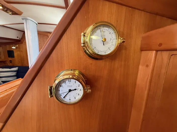 Chance Yacht Photos Pics Brass clock and barometer on wooden panel inside 1999 Tartan 4100 sailboat.