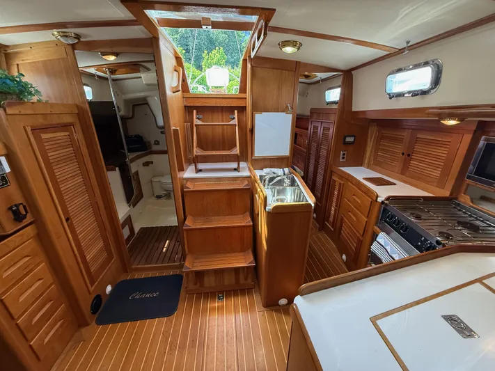 Chance Yacht Photos Pics Interior of a 1999 Tartan 4100 sailboat with wooden cabinetry and modern amenities.