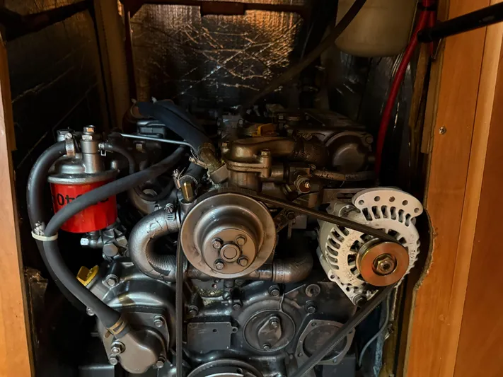 Chance Yacht Photos Pics Engine compartment of a 1999 Tartan 4100 sailboat, showcasing mechanical components and wiring.