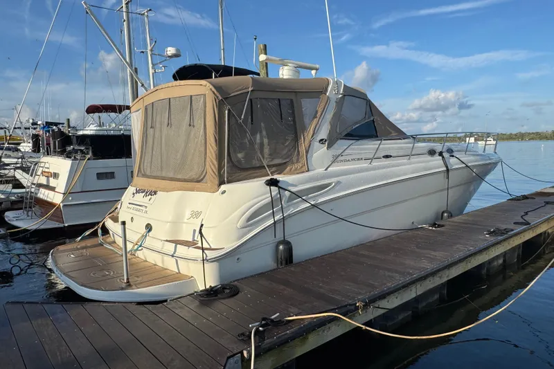 Solid Rock Yacht Photos Pics 2003 Sea Ray 380 Sundancer yacht docked at marina under clear blue sky.