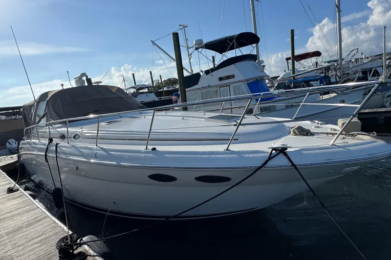 Solid Rock Yacht Photos Pics 2003 Sea Ray 380 Sundancer yacht docked at marina under clear blue sky.