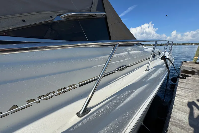 Solid Rock Yacht Photos Pics 2003 Sea Ray 380 Sundancer yacht docked, showcasing sleek design and chrome railings.