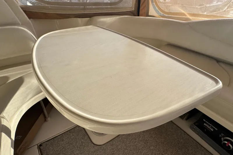 Solid Rock Yacht Photos Pics Interior of 2003 Sea Ray 380 Sundancer with beige seating and table.