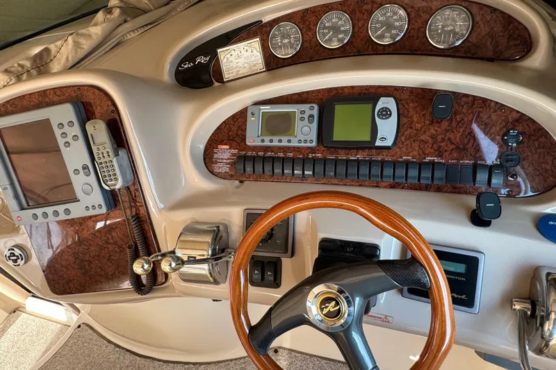 Solid Rock Yacht Photos Pics Control panel of a 2003 Sea Ray 380 Sundancer boat with navigation instruments.