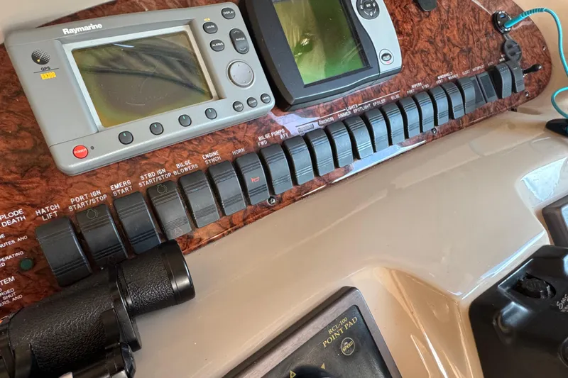 Solid Rock Yacht Photos Pics Control panel of a 2003 Sea Ray 380 Sundancer with navigation equipment and switches.